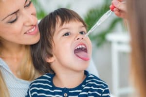 Homeopathy. Mother and little boy visiting a homeopath