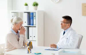senior woman and doctor meeting at hospital